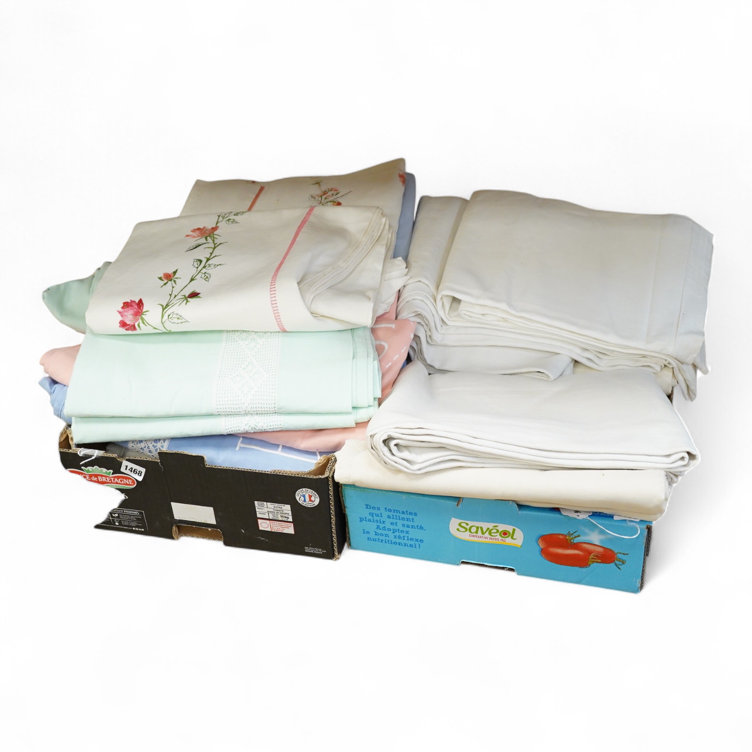 Thirteen mixed French mostly coloured provincial linen sheets some embroidered with monograms, floral embroidery, or decorated with crochet.